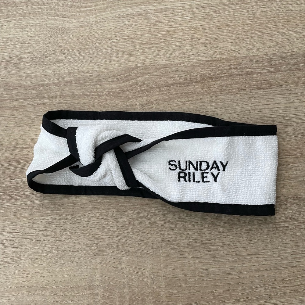 Brand new exclusive Sunday Riley headband. Twist front, Velcro back. Skincare